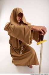 JOEL_ADAMSON MONK KNEELING POSE WITH SWORD